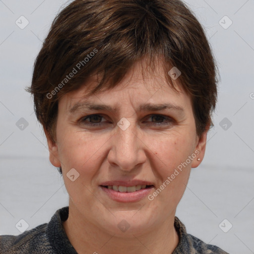 Joyful white adult female with medium  brown hair and grey eyes