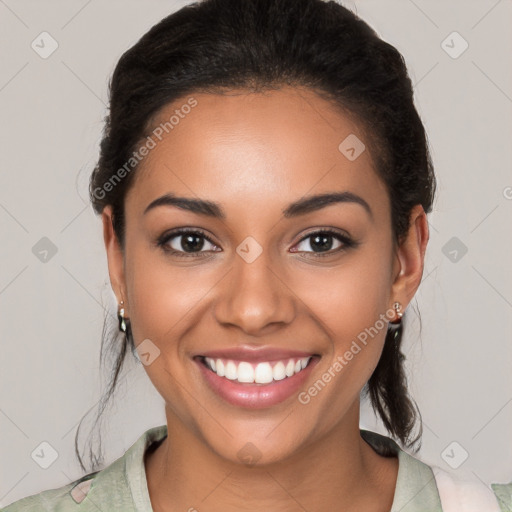 Joyful latino young-adult female with medium  brown hair and brown eyes