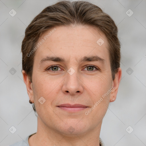 Joyful white adult male with short  brown hair and grey eyes