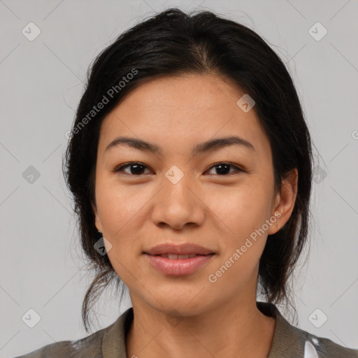 Joyful asian young-adult female with medium  black hair and brown eyes