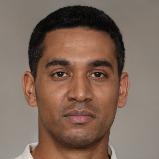 Neutral black young-adult male with short  black hair and brown eyes