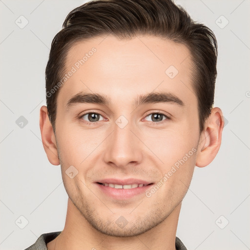 Joyful white young-adult male with short  brown hair and brown eyes