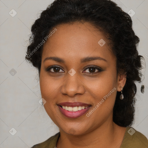 Joyful black young-adult female with long  brown hair and brown eyes