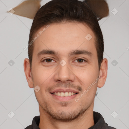 Joyful white young-adult male with short  brown hair and brown eyes