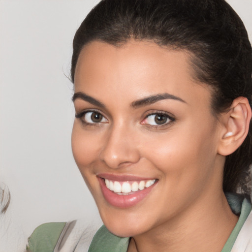 Joyful white young-adult female with medium  brown hair and brown eyes