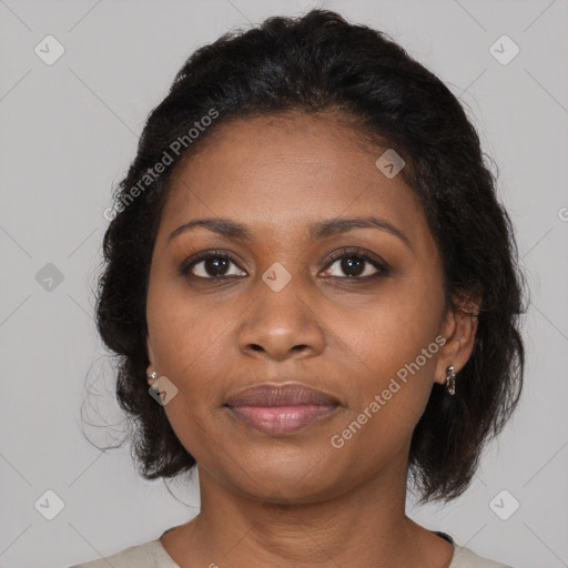 Joyful black young-adult female with medium  brown hair and brown eyes