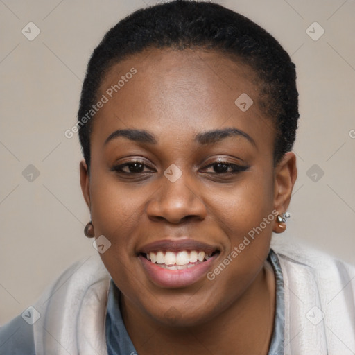 Joyful black young-adult female with short  black hair and brown eyes