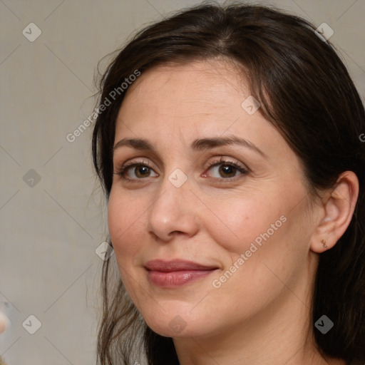 Joyful white adult female with medium  brown hair and brown eyes