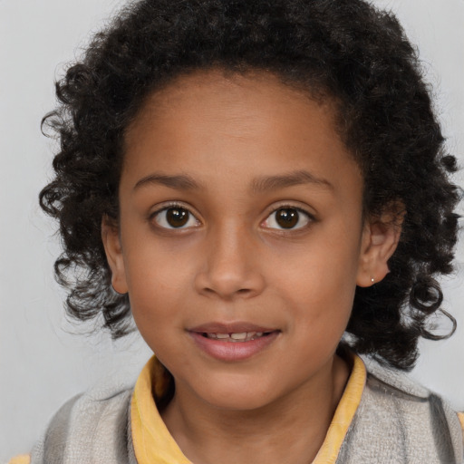 Joyful black child female with long  brown hair and brown eyes
