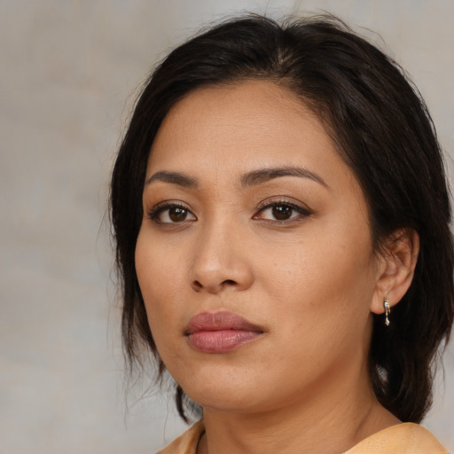 Neutral asian young-adult female with medium  brown hair and brown eyes