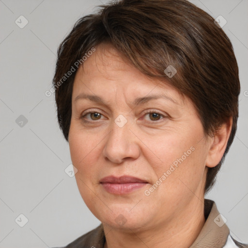 Joyful white adult female with short  brown hair and brown eyes