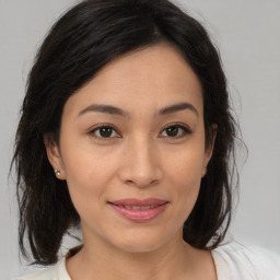 Joyful white young-adult female with medium  brown hair and brown eyes