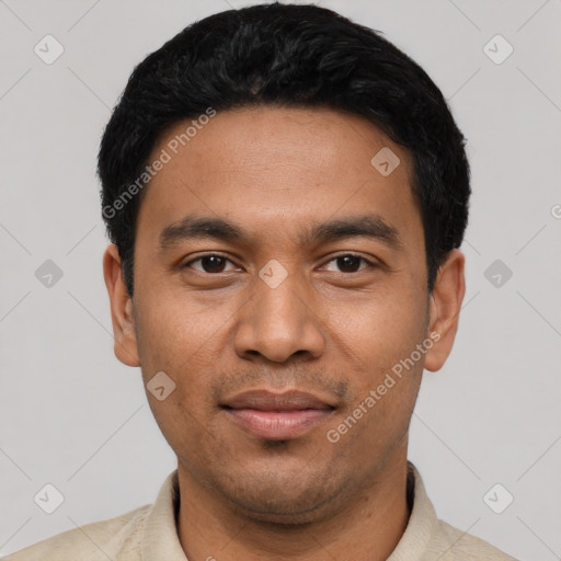 Joyful latino young-adult male with short  black hair and brown eyes