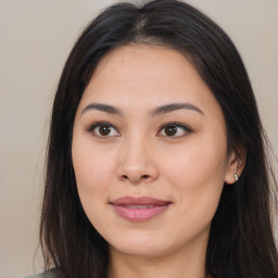 Joyful asian young-adult female with long  brown hair and brown eyes