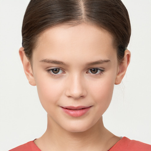 Joyful white child female with short  brown hair and brown eyes