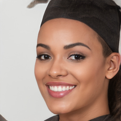 Joyful latino young-adult female with short  black hair and brown eyes