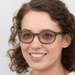 Joyful white young-adult female with medium  brown hair and blue eyes