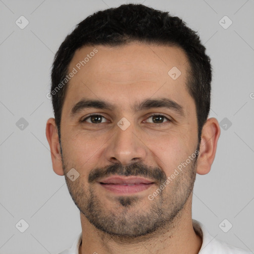 Joyful white young-adult male with short  black hair and brown eyes