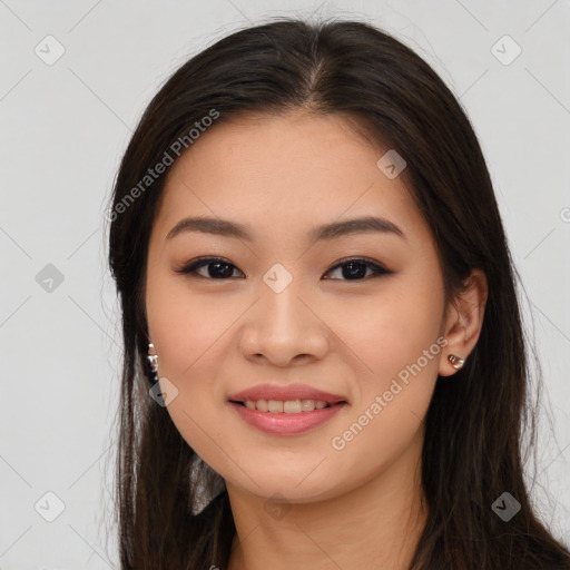 Joyful asian young-adult female with long  brown hair and brown eyes