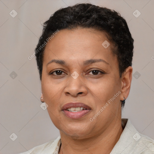 Joyful black adult female with short  brown hair and brown eyes