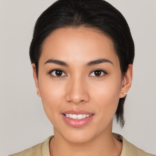 Joyful asian young-adult female with medium  brown hair and brown eyes