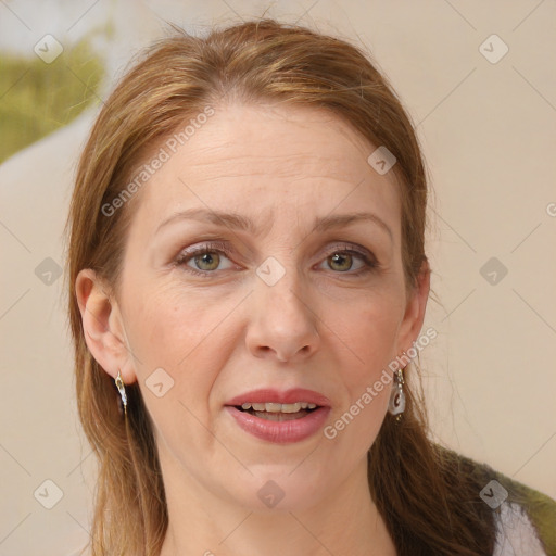 Joyful white adult female with long  brown hair and grey eyes