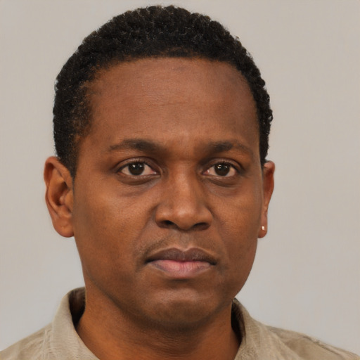 Neutral black young-adult male with short  brown hair and brown eyes