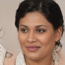 Joyful white adult female with medium  brown hair and brown eyes