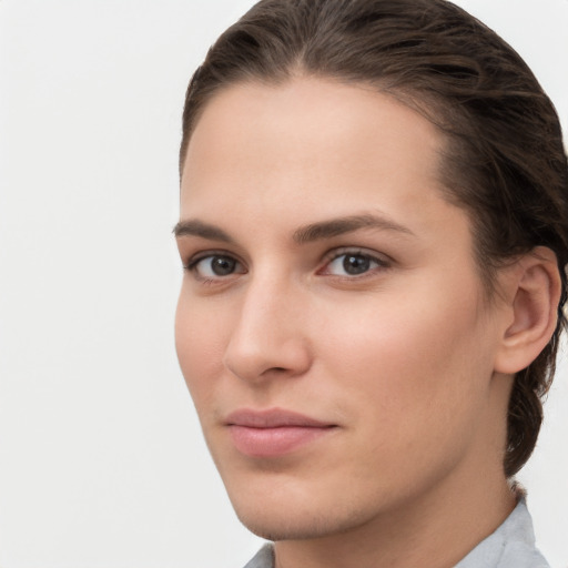 Neutral white young-adult female with short  brown hair and brown eyes