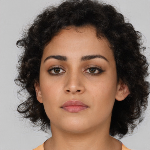 Neutral latino young-adult female with medium  brown hair and brown eyes