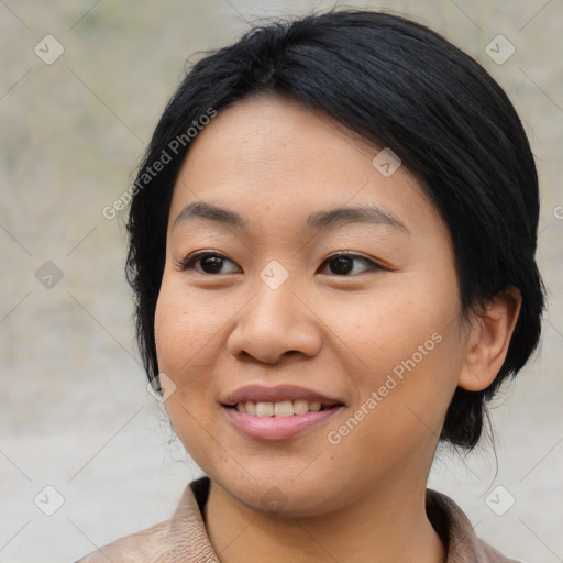 Joyful asian young-adult female with medium  black hair and brown eyes