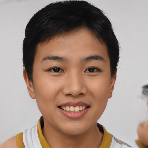 Joyful asian young-adult female with short  black hair and brown eyes