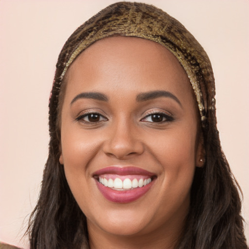 Joyful white young-adult female with long  brown hair and brown eyes