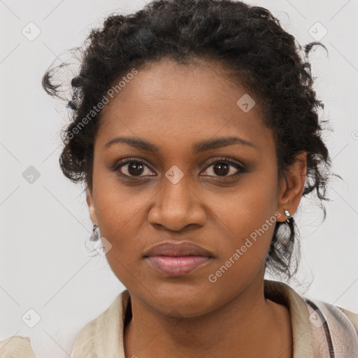 Joyful black young-adult female with long  brown hair and brown eyes