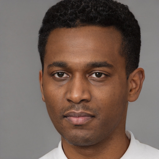 Neutral black young-adult male with short  black hair and brown eyes