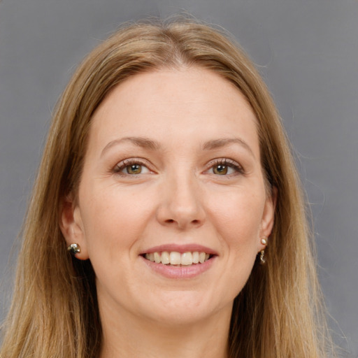 Joyful white young-adult female with long  brown hair and grey eyes