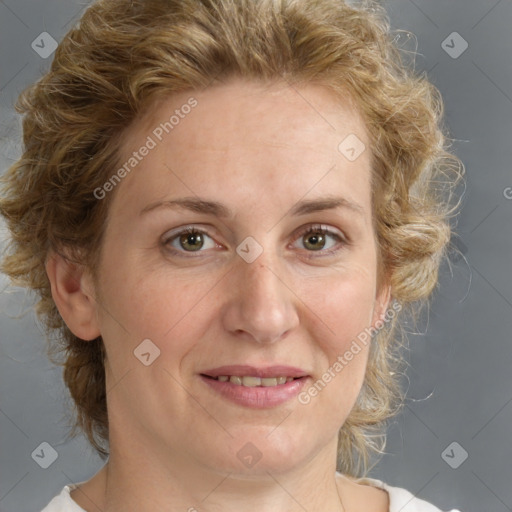 Joyful white adult female with medium  brown hair and blue eyes