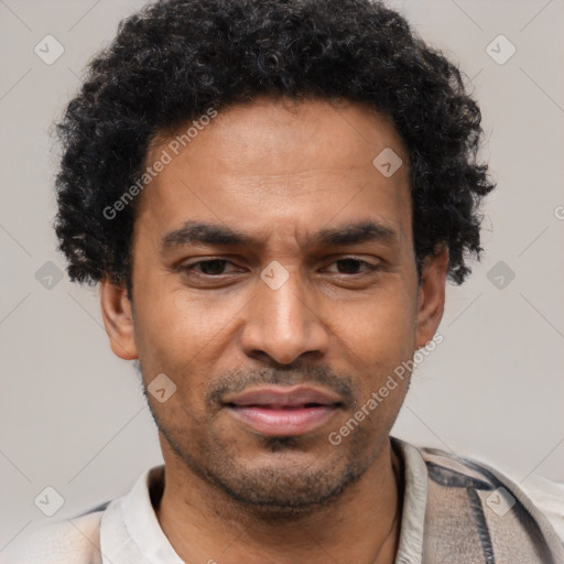 Joyful latino adult male with short  black hair and brown eyes