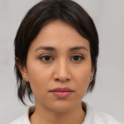 Neutral asian young-adult female with medium  brown hair and brown eyes