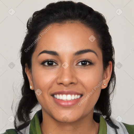 Joyful latino young-adult female with long  black hair and brown eyes