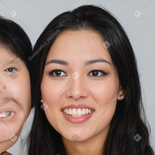 Joyful asian young-adult female with long  black hair and brown eyes