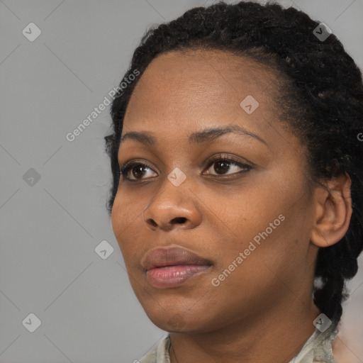 Neutral black young-adult female with short  black hair and brown eyes