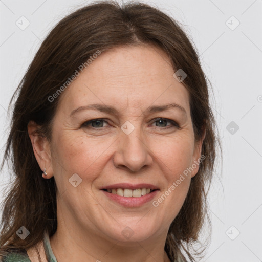 Joyful white adult female with medium  brown hair and grey eyes