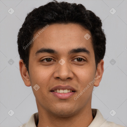 Joyful latino young-adult male with short  brown hair and brown eyes