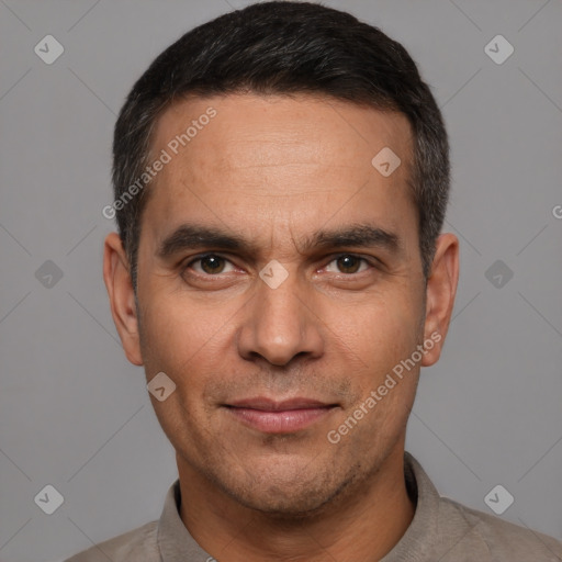 Joyful white adult male with short  black hair and brown eyes