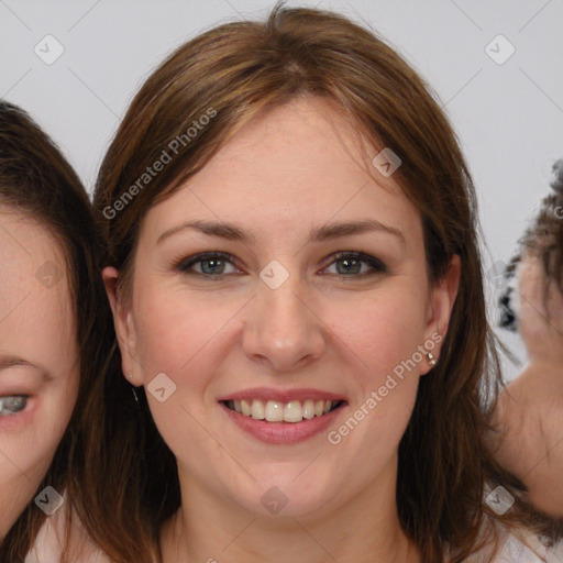 Joyful white young-adult female with medium  brown hair and blue eyes
