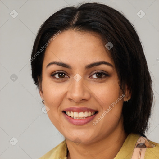 Joyful latino young-adult female with medium  brown hair and brown eyes