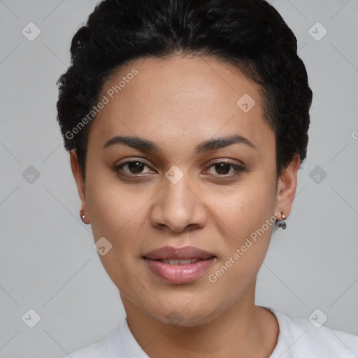 Joyful black young-adult female with short  black hair and brown eyes