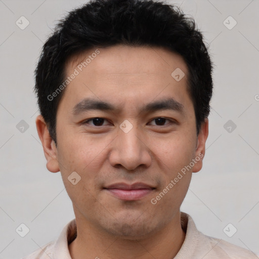 Joyful asian young-adult male with short  black hair and brown eyes