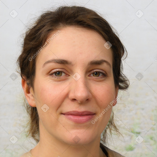 Joyful white adult female with medium  brown hair and grey eyes